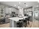 Contemporary kitchen with a kitchen island, stainless appliances, and barstool seating at 2451 Spring Breeze Dr, Leesburg, FL 34748