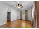 Comfortable bedroom with hardwood floors and ceiling fan plus closet space for organization and storage solutions at 2545 Dellwood Dr, Orlando, FL 32806