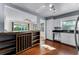 View of the kitchen and wine rack, complete with stainless steel appliances and a view into the dining area at 2545 Dellwood Dr, Orlando, FL 32806