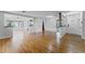 Spacious living room with gleaming hardwood floors and an open layout, perfect for entertaining and comfortable living at 2545 Dellwood Dr, Orlando, FL 32806