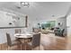 Stylishly staged living room with open floor plan, hardwood floors, and abundant natural light for a modern appeal at 2545 Dellwood Dr, Orlando, FL 32806