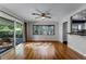 Bright living room features hardwood floors, access to the patio, and natural light at 2545 Dellwood Dr, Orlando, FL 32806