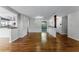 Bright living room with hardwood floors and white trim showcases the open-concept design, complemented by natural light at 2545 Dellwood Dr, Orlando, FL 32806