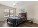 Cozy bedroom with a window, ceiling fan, and modern decor creating a relaxing retreat at 2624 Lodi Cir # 101, Kissimmee, FL 34746