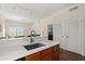 Open-concept kitchen with a breakfast bar that connects to the living area, great for entertaining guests at 2624 Lodi Cir # 101, Kissimmee, FL 34746