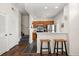 Modern kitchen with stainless steel appliances and a breakfast bar at 2624 Lodi Cir # 101, Kissimmee, FL 34746