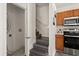 Galley kitchen adjacent to staircase and laundry room, making chores more efficient and accessible at 2624 Lodi Cir # 101, Kissimmee, FL 34746