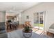 Cozy living room with hardwood floors, seating, kitchen view, and natural light at 2624 Lodi Cir # 101, Kissimmee, FL 34746