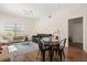 Cozy living room featuring a glass table, comfortable seating, and natural light at 2624 Lodi Cir # 101, Kissimmee, FL 34746