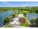 Aerial view shows playground, splashpad, lake, volleyball and basketball courts at 2624 Lodi Cir # 101, Kissimmee, FL 34746