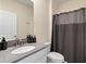 Bathroom featuring a sink with a grey countertop and a shower with a gray curtain at 2805 Bookmark Dr, Kissimmee, FL 34746