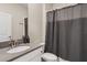 Bathroom featuring a sink with a grey countertop and a shower with a gray curtain at 2805 Bookmark Dr, Kissimmee, FL 34746