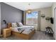 Modern bedroom features a gray accent wall, stylish lighting, and comfortable furnishings at 2805 Bookmark Dr, Kissimmee, FL 34746