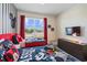 Bright ' bedroom with playful decor, a window view, and plenty of space at 2805 Bookmark Dr, Kissimmee, FL 34746