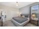 Bedroom with a gray bed, white closet, and a view of the living area at 2805 Bookmark Dr, Kissimmee, FL 34746