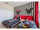 Playful ' bedroom showcases striped walls, themed decorations, and bright, comfortable bedding at 2805 Bookmark Dr, Kissimmee, FL 34746