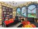 Whimsical ' bedroom with a bookshelf, custom mural, and themed decorations for immersive play at 2805 Bookmark Dr, Kissimmee, FL 34746