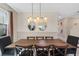 Dining room with rustic wood table and pendant lighting, perfect for Gathering gatherings at 2805 Bookmark Dr, Kissimmee, FL 34746