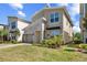 Inviting home features well-maintained lawn, stone facade, and modern design elements at 2805 Bookmark Dr, Kissimmee, FL 34746