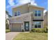 Charming two-story home boasts stone accents, manicured lawn, and a welcoming entrance at 2805 Bookmark Dr, Kissimmee, FL 34746