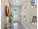 Foyer with decorative mirror and glass table at 2805 Bookmark Dr, Kissimmee, FL 34746