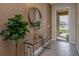 Foyer featuring a decorative round mirror and plant at 2805 Bookmark Dr, Kissimmee, FL 34746