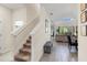 Hallway with stairs leading to the upper level and a glimpse of the living area at 2805 Bookmark Dr, Kissimmee, FL 34746