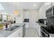 Kitchen featuring a center island with seating and stainless steel appliances at 2805 Bookmark Dr, Kissimmee, FL 34746