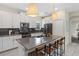 Kitchen featuring white cabinets, a center island, and modern appliances at 2805 Bookmark Dr, Kissimmee, FL 34746