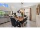 Living room with dining table and view of the pool area at 2805 Bookmark Dr, Kissimmee, FL 34746