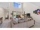 The living room features an open layout and a view to the pool beyond at 2805 Bookmark Dr, Kissimmee, FL 34746