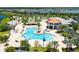 Beautiful community pool and clubhouse with lush landscaping and resort-style amenities at 2805 Bookmark Dr, Kissimmee, FL 34746