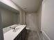 Clean, well-lit bathroom with a tub and shower combination at 2978 Aqua Virgo Loop # 13, Orlando, FL 32837