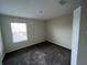 A carpeted bedroom with neutral walls and natural light at 2978 Aqua Virgo Loop # 13, Orlando, FL 32837