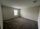 A carpeted bedroom with a window bringing in natural light at 2978 Aqua Virgo Loop # 13, Orlando, FL 32837