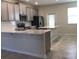 Modern kitchen featuring quartz countertops, stainless steel appliances, and ample cabinet space at 2978 Aqua Virgo Loop # 13, Orlando, FL 32837