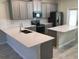 Modern kitchen featuring quartz countertops, stainless steel appliances, and ample cabinet space at 2978 Aqua Virgo Loop # 13, Orlando, FL 32837