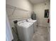 Functional laundry room with modern appliances and storage space at 2978 Aqua Virgo Loop # 13, Orlando, FL 32837