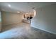 Open-concept living area featuring tile floors and a staircase to the upper level at 2978 Aqua Virgo Loop # 13, Orlando, FL 32837