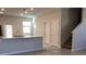 Spacious open-plan room showing living and kitchen areas and a stairway at 2978 Aqua Virgo Loop # 13, Orlando, FL 32837