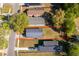 An aerial view of a single-Gathering home with a long driveway bordered with a red outline and grassy backyard at 3063 Jon Jon Ct, Orlando, FL 32822