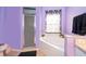 Bathroom featuring a corner bathtub with jacuzzi jets and a separate shower at 3063 Jon Jon Ct, Orlando, FL 32822