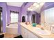 Stylish bathroom featuring double sinks, soaking tub, and a separate shower at 3063 Jon Jon Ct, Orlando, FL 32822