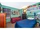 Bedroom featuring two twin beds, green walls and comic book decorations at 3063 Jon Jon Ct, Orlando, FL 32822