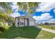 Inviting single-Gathering home with manicured lawn, lush tree coverage, and attached two-car garage at 3063 Jon Jon Ct, Orlando, FL 32822