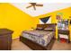 Bright main bedroom with a ceiling fan and a dark wood furniture set at 3063 Jon Jon Ct, Orlando, FL 32822
