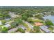 Scenic aerial view highlighting the home's proximity to the lake and its lush, tree-lined neighborhood at 3107 Troy Dr, Orlando, FL 32806