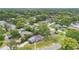 Aerial view of a neighborhood showcasing the home's location, surrounded by lush greenery and mature trees at 3107 Troy Dr, Orlando, FL 32806