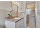 Bright bathroom with vanity and storage, with a tiled shower at 3107 Troy Dr, Orlando, FL 32806