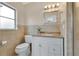 Bright bathroom featuring a vanity with storage and a tiled shower at 3107 Troy Dr, Orlando, FL 32806